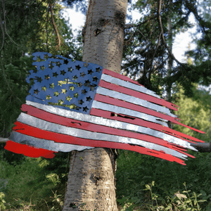 A photograph of a Tattered US Flag by the metal art manufacturer Kraken Design Co.