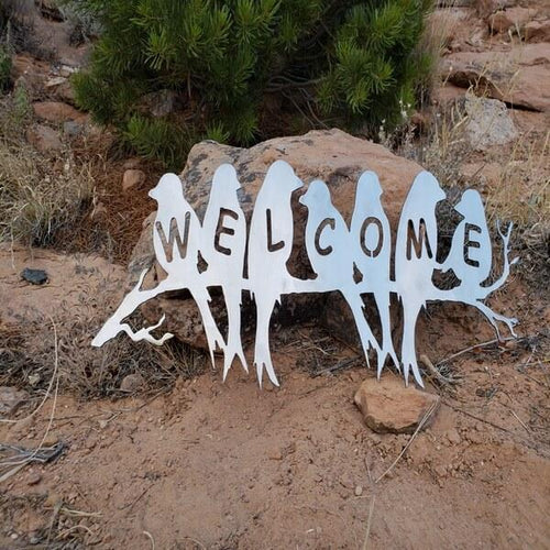 A photograph of a Welcome Birds by the metal art manufacturer Kraken Design Co.
